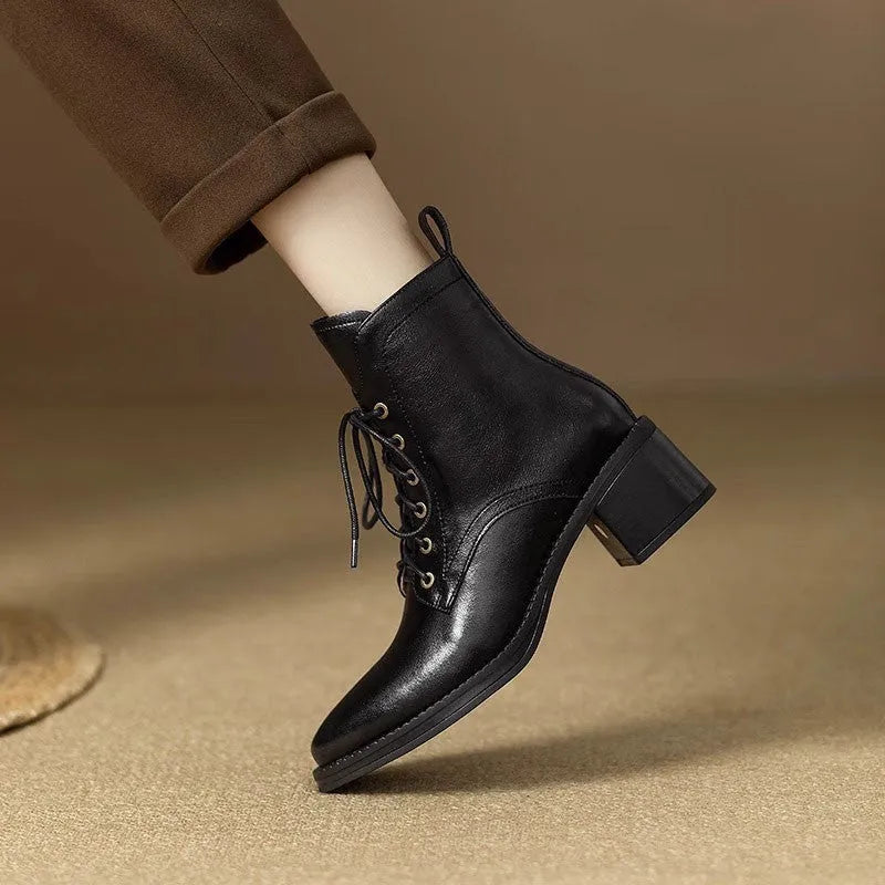 Women's black pointed-toe short tube boots with 5.5cm heel and artificial PU upper