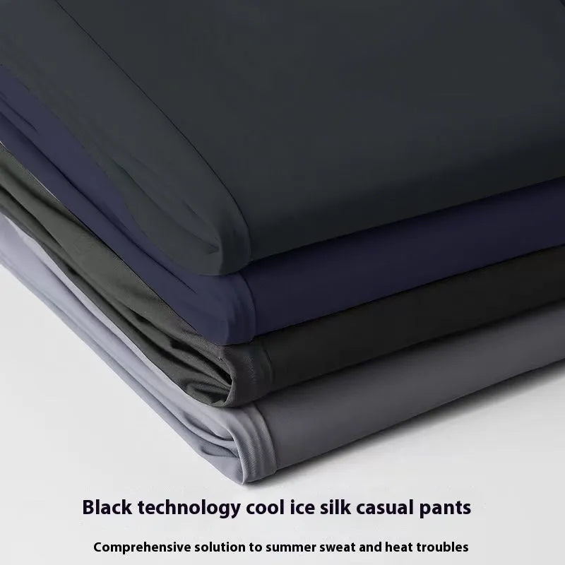 Men's loose fit ice silk straight leg trousers in solid black, light gray, and dark blue with high elastic waist.