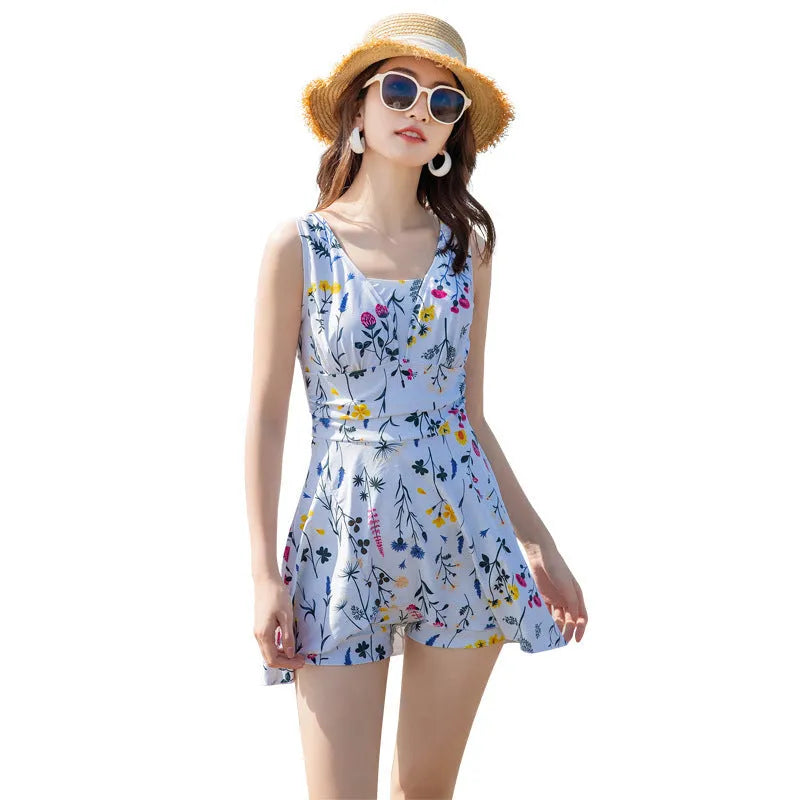 Women's one-piece floral swimsuit in lavender polyester fibre, front view