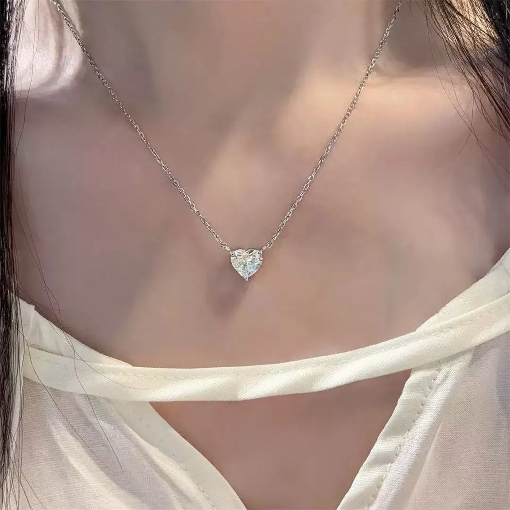 Women's silver colour heart pendant necklace on copper chain, minimalist jewellery design