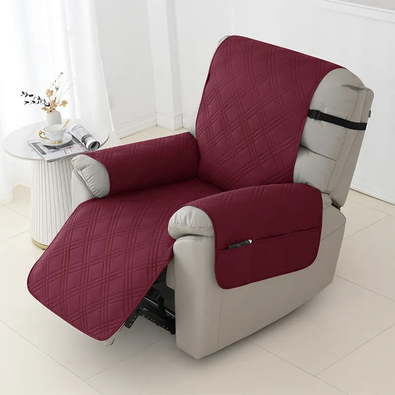 Quilted waterproof sofa cover in burgundy on a single seat massage chair
