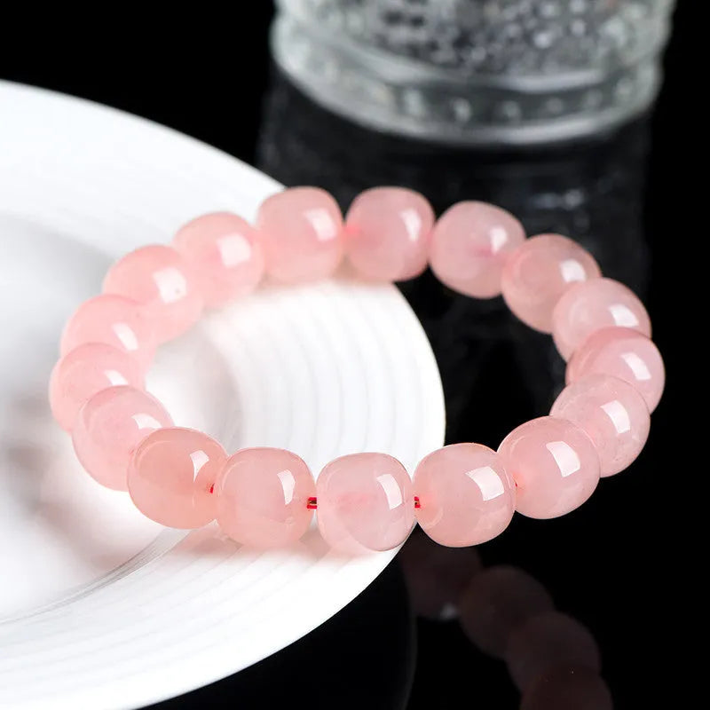 Pink natural crystal bracelet with barrel shaped beads in geometric design