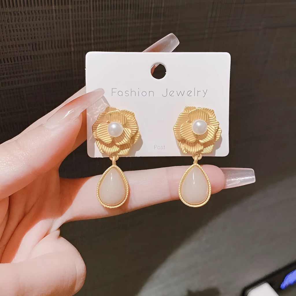 Gold Hong Kong style floral stud earrings with pearl and opal decoration