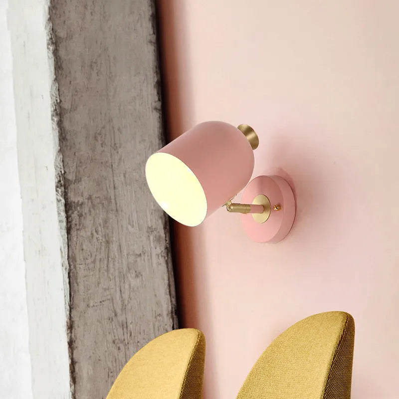 Single-head aluminium wall lamp with mirror front in choice of yellow, green, blue, or pink light.