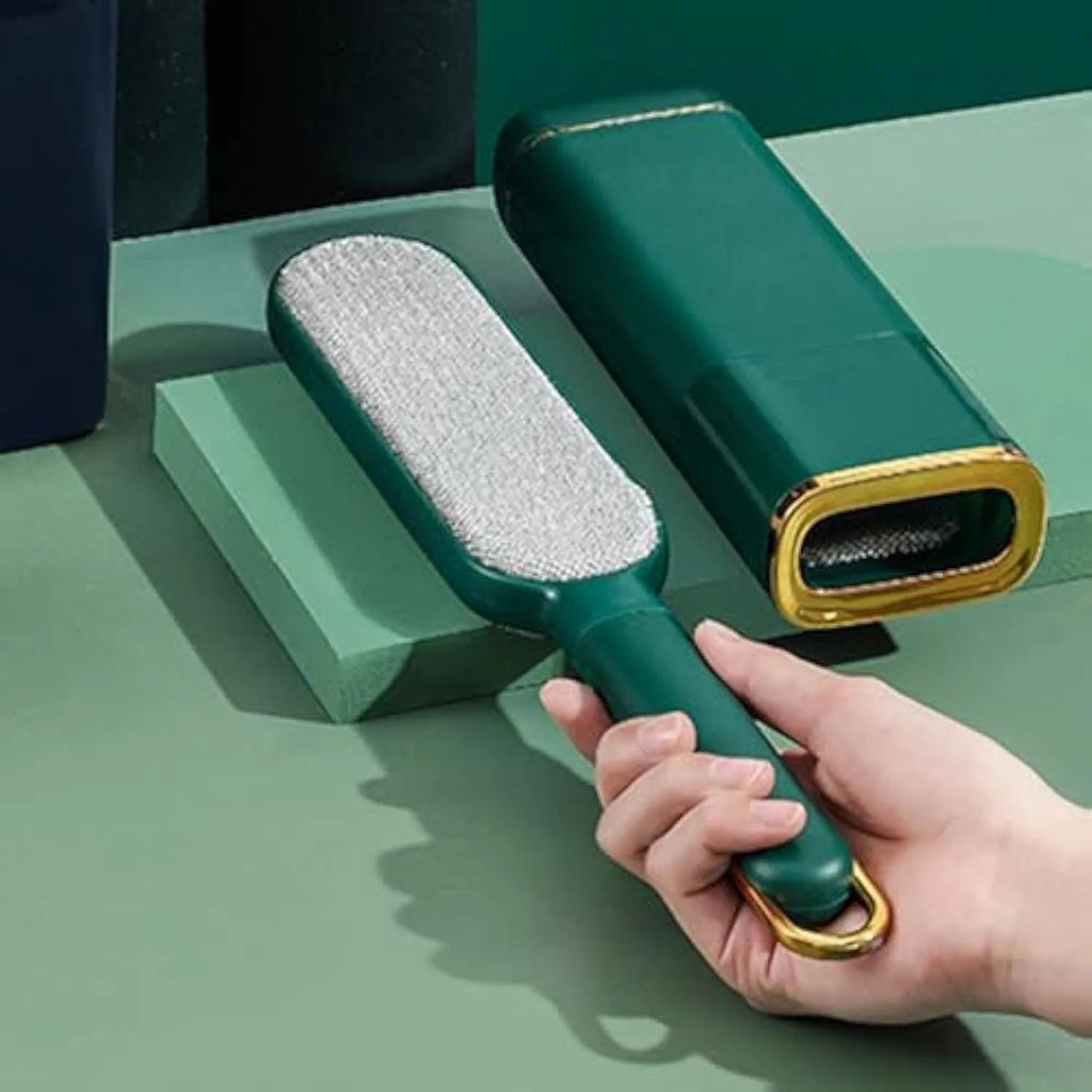 Blue reusable pet hair remover brush with storage base for collecting shed hair from fabrics.