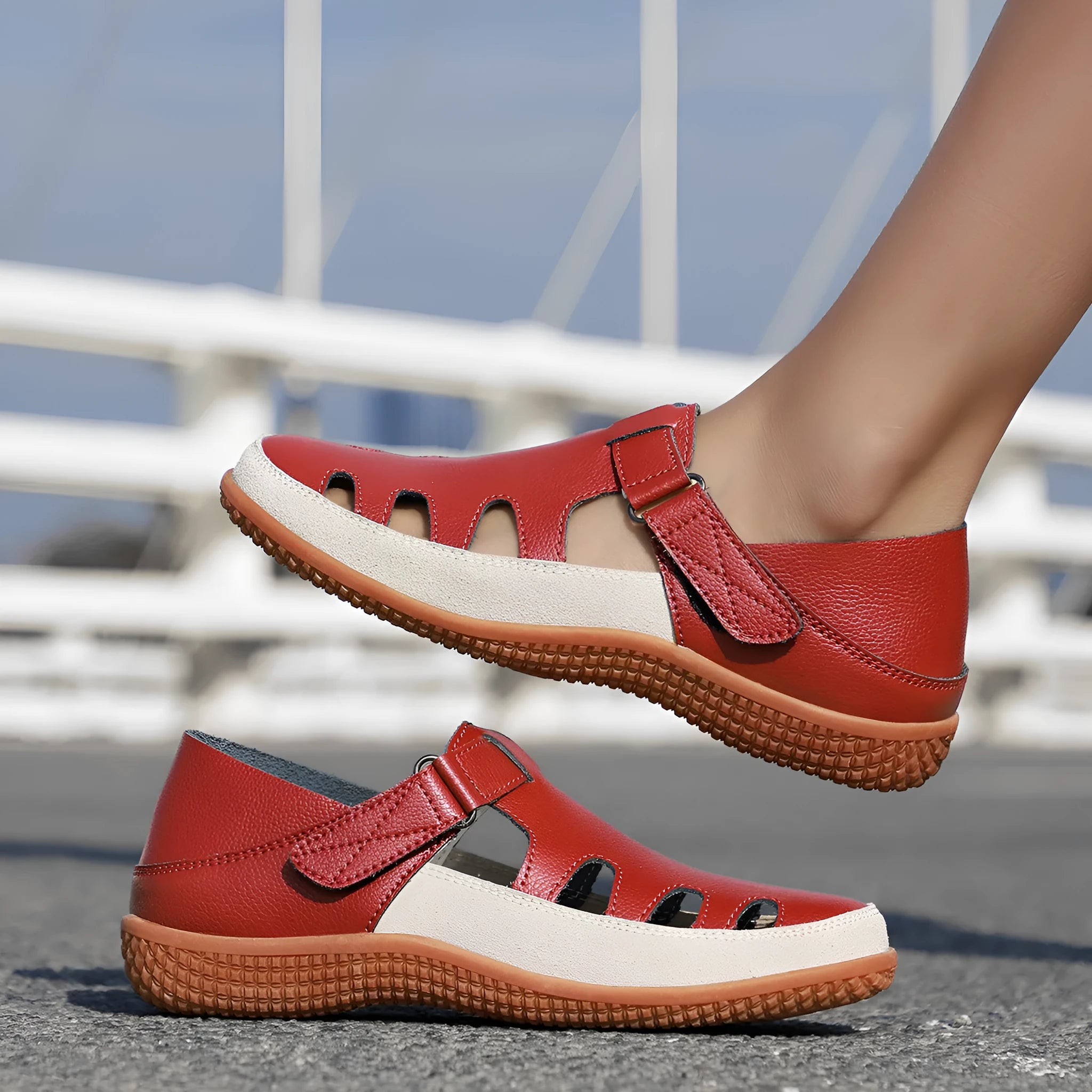 Women's plus size flat sandals with hollow out toe cap in blue, red, or white on thick rubber sole.