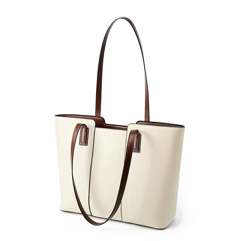 Women's black genuine leather crossbody commuter bag with square shape and multiple internal pockets.