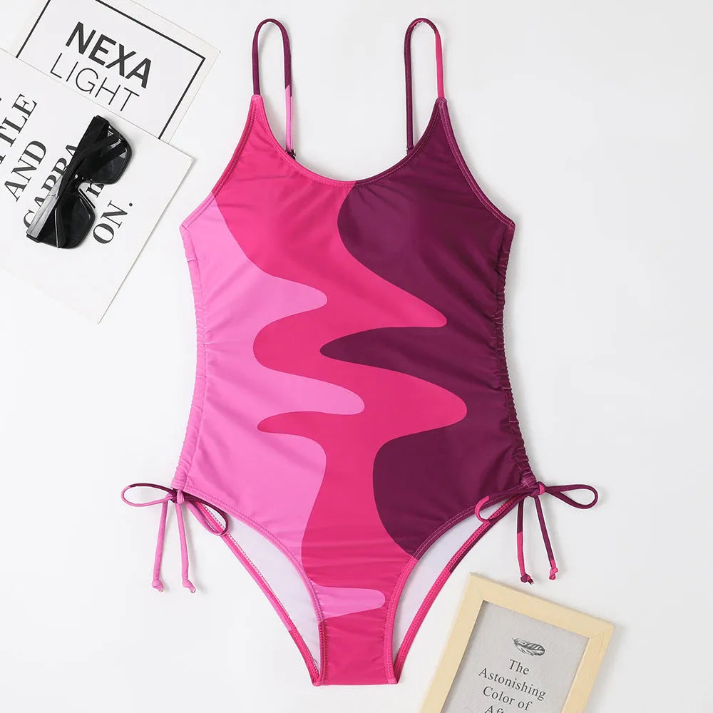 Women's sleeveless one-piece swimsuit in blue, purple, brown or green with fixed swimming trunks