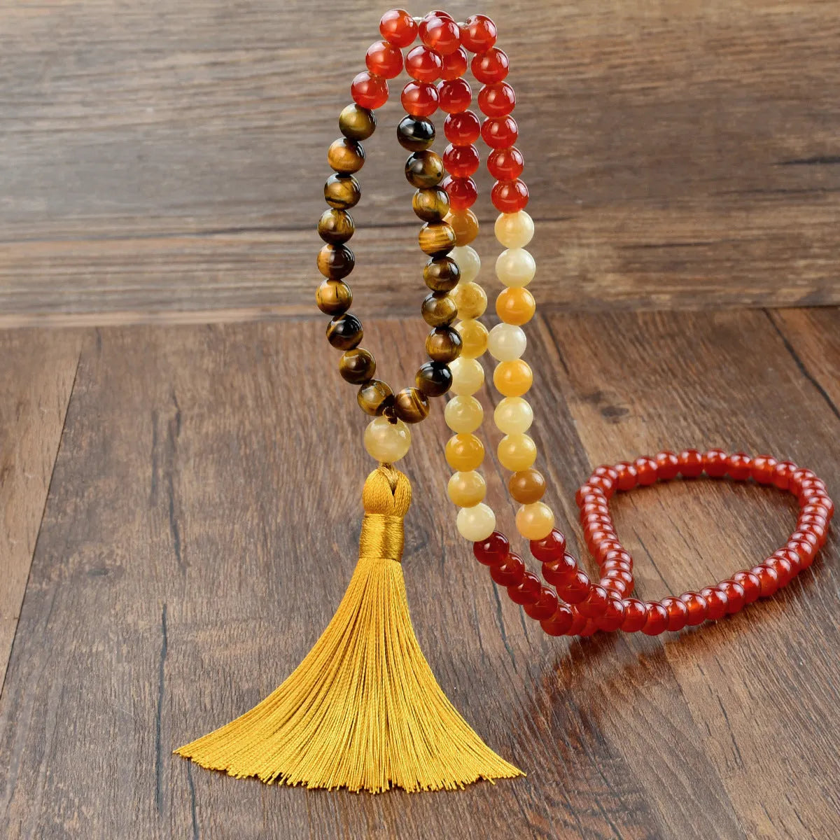 Long 108 natural stone bead necklace with mixed gemstone tassel pendant in bohemian style.