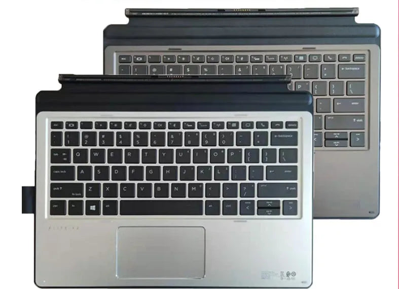 Official HP Elite X2 1012 tablet keyboard base on a desk, showing full keyboard layout and PS/2 connection cable.