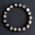 Obsidian crater ball bracelet with grinding texture in silver or golden meteorite colours