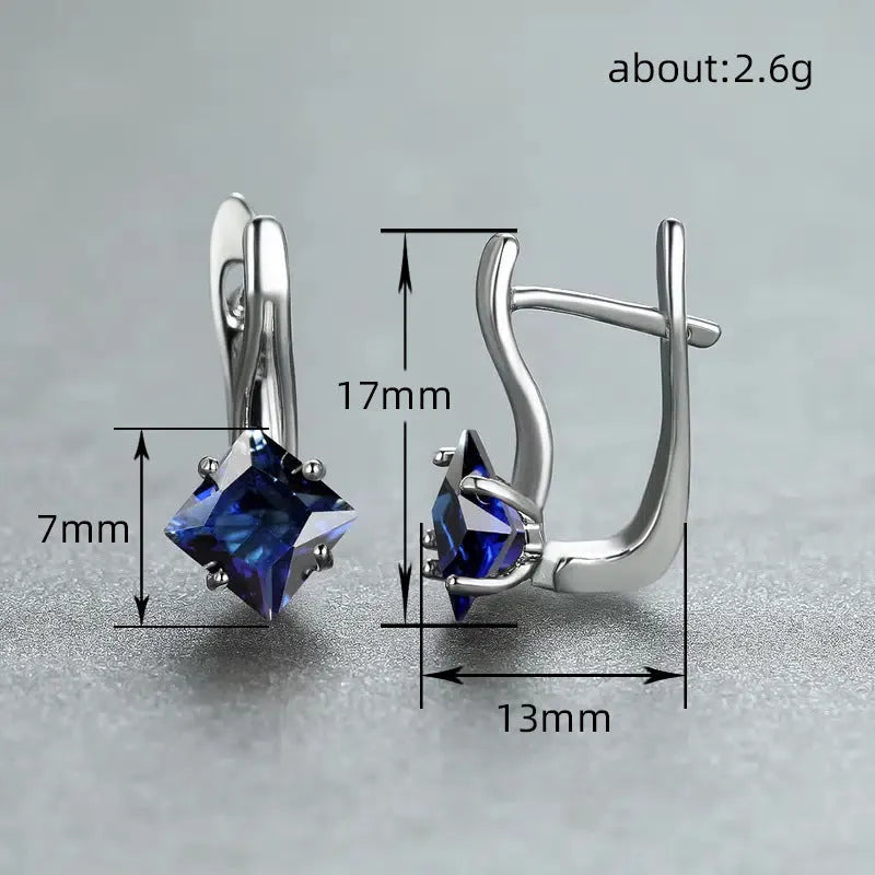 Women's copper earrings with a diamond design and inlaid blue zircon stones.