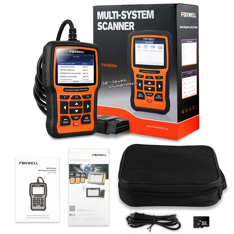 Foxwell NT510 orange and black automotive diagnostic scanner with data cable on workbench