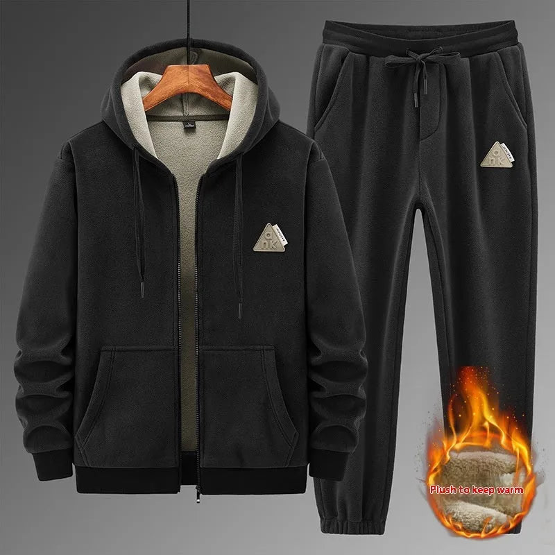 Grey cashmere-blend hooded sweater and matching trousers men's sports suit set on a hanger.