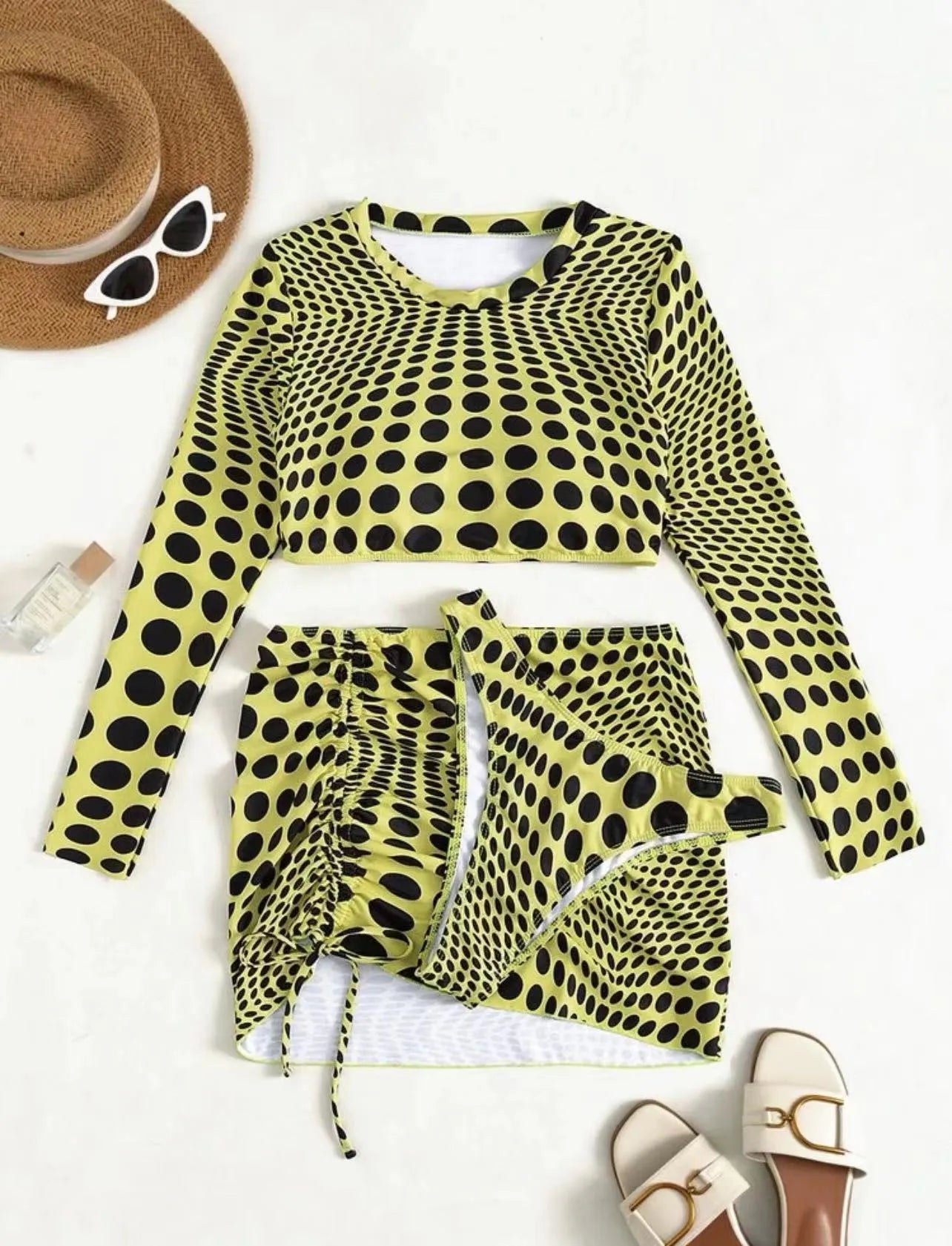 Green and yellow polka dot women's three-piece swimsuit set with bra, bikini top, and skirt.