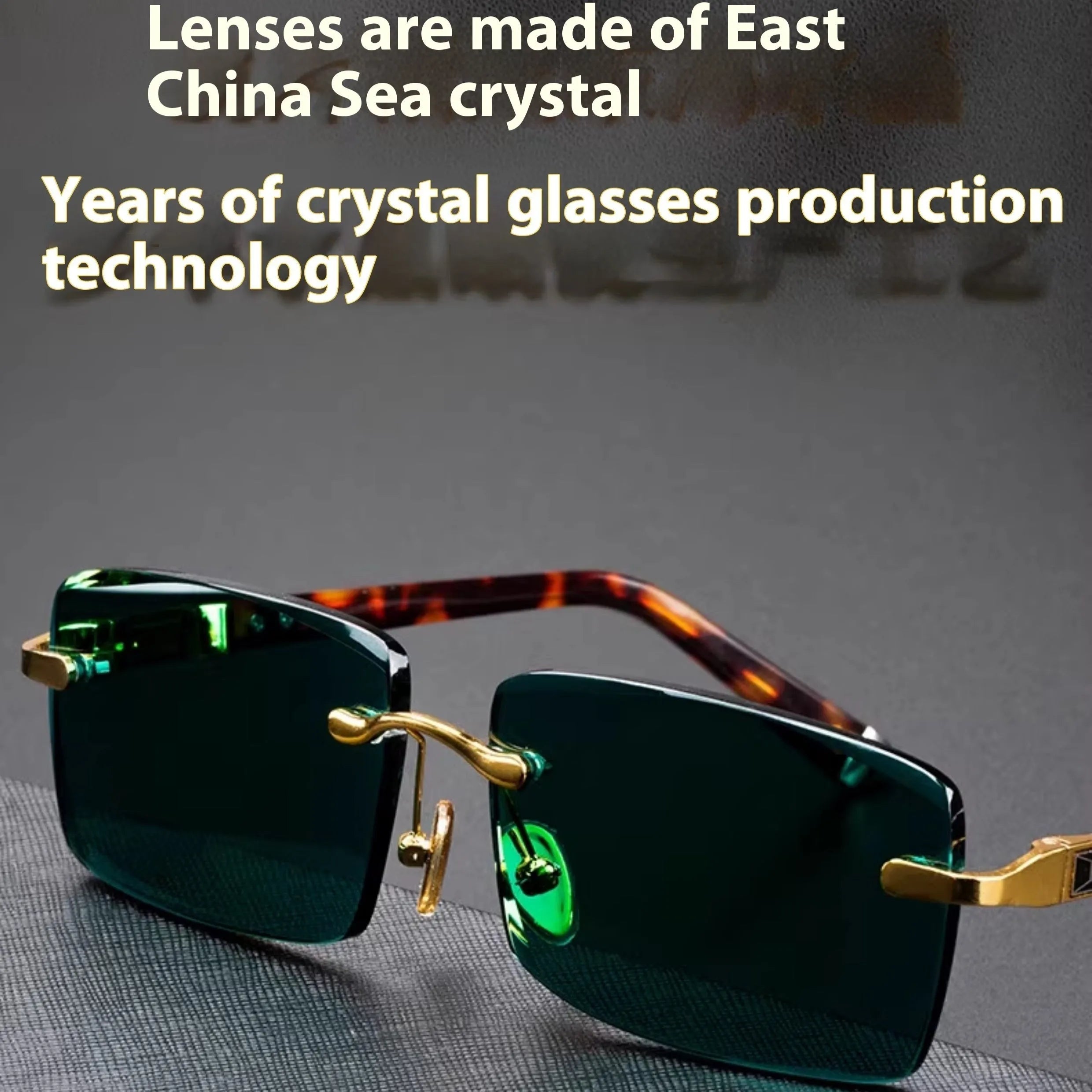 A pair of frameless sunglasses with dark green crystal lenses, shown with a glasses case and cleaning cloth.