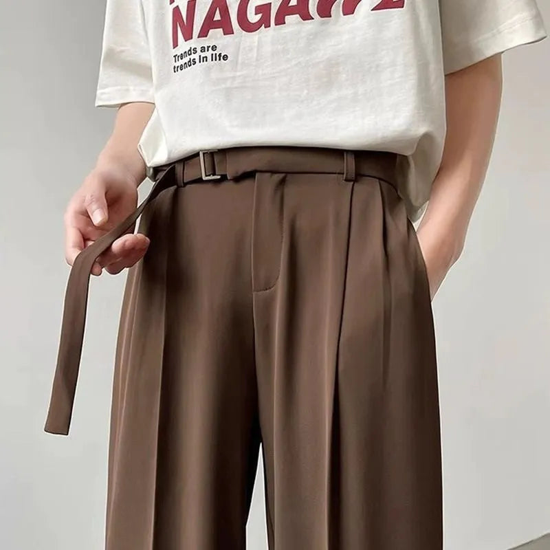 Black straight leg wide trousers with loose fit and non-iron chemical fibre fabric in solid colour.