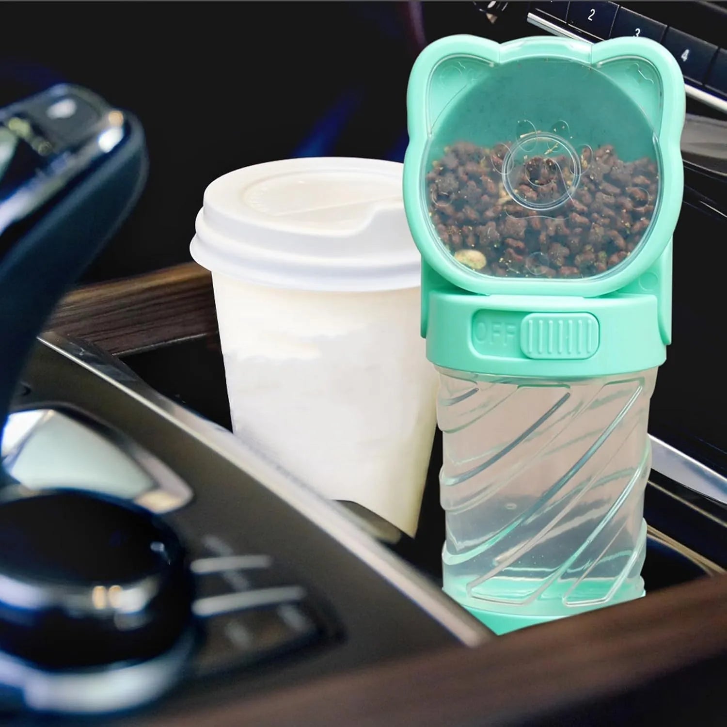 Green 3-in-1 portable pet water bottle with water dispenser, food container, and garbage bag compartment