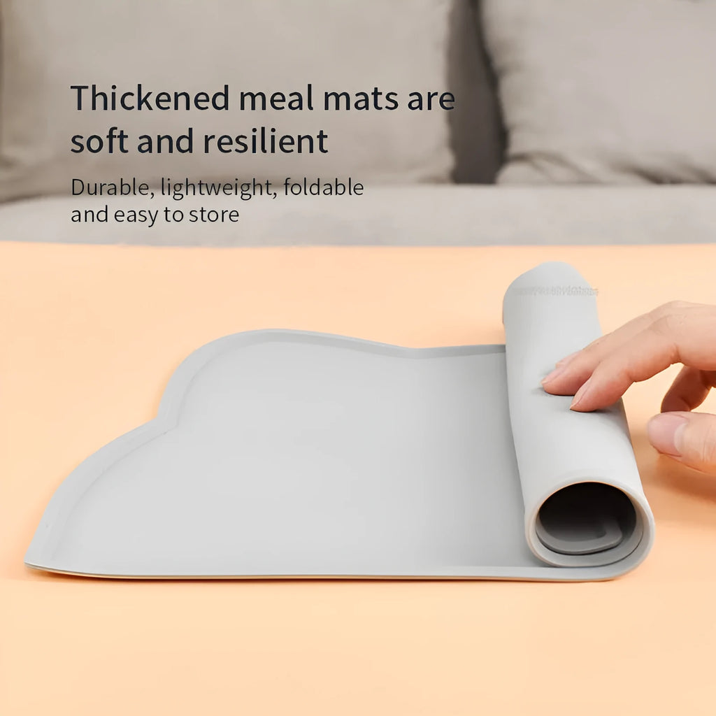 Silicone waterproof pet feeding mat with cat head design measuring 44x24cm in solid colours