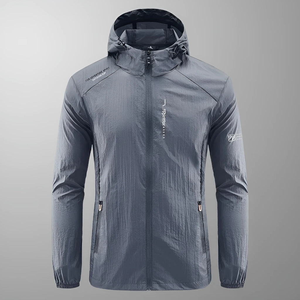 Lightweight men's hooded nylon summer jacket in loose fit on a hanger.