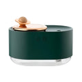 Green rotating planet humidifier with USB charging port and night light on wooden surface