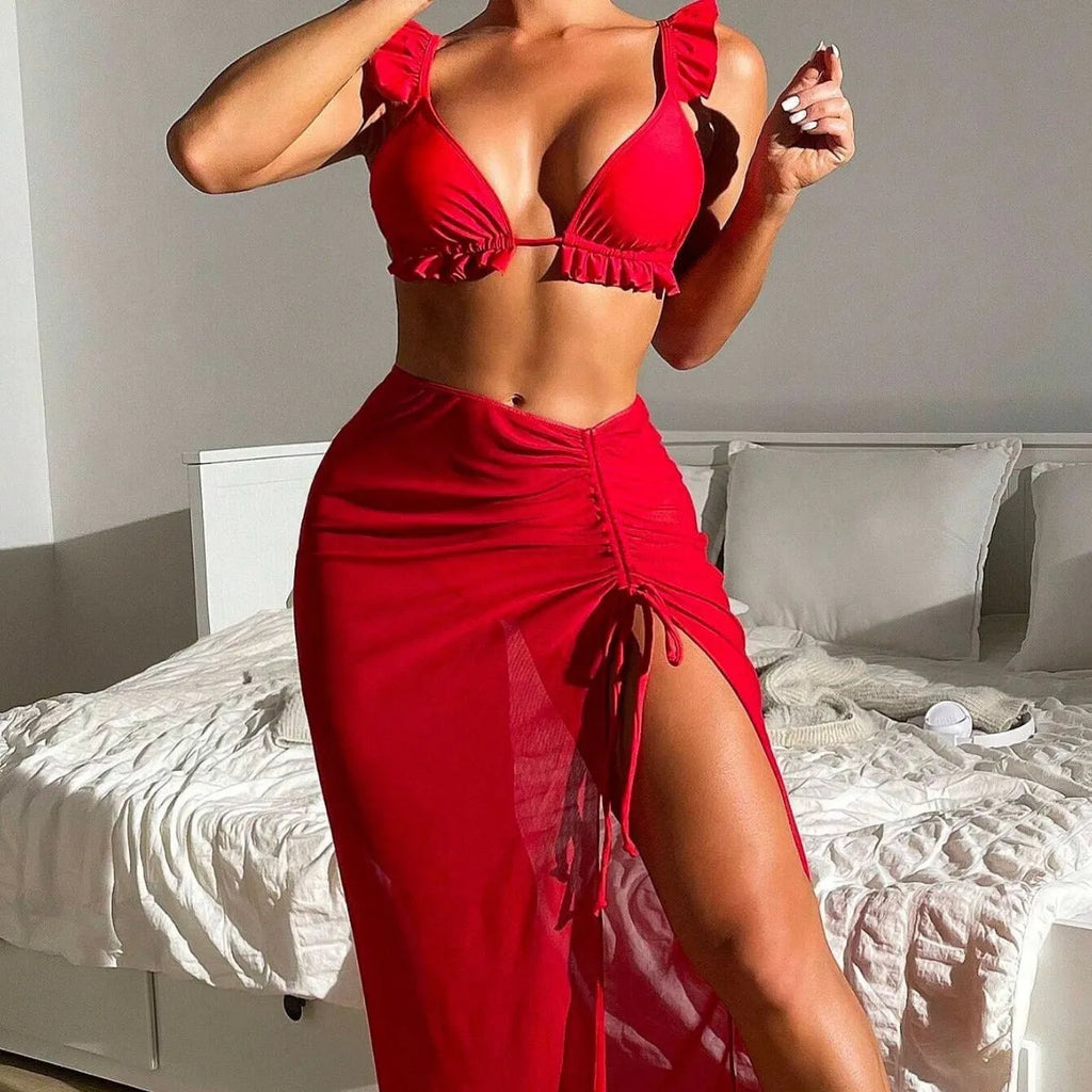 Women's printed three-piece swimsuit set with skirt overlay and high-waist bikini bottoms