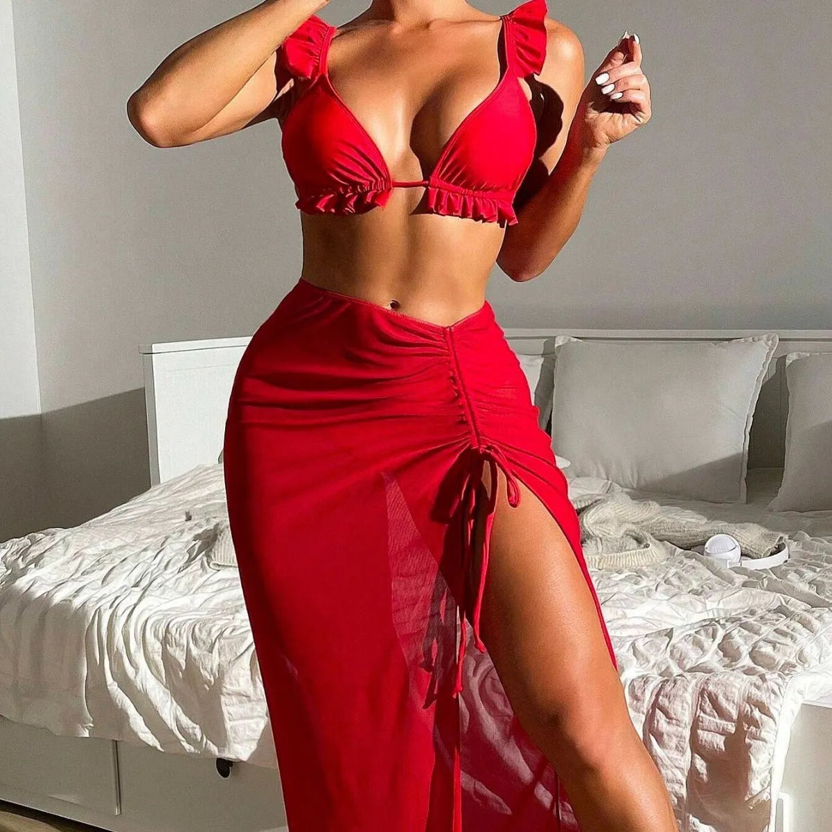 Women's printed three-piece swimsuit set with skirt overlay and high-waist bikini bottoms