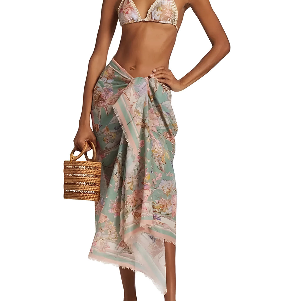Women's creamy white floral bikini set with matching skirt for beach and swimming