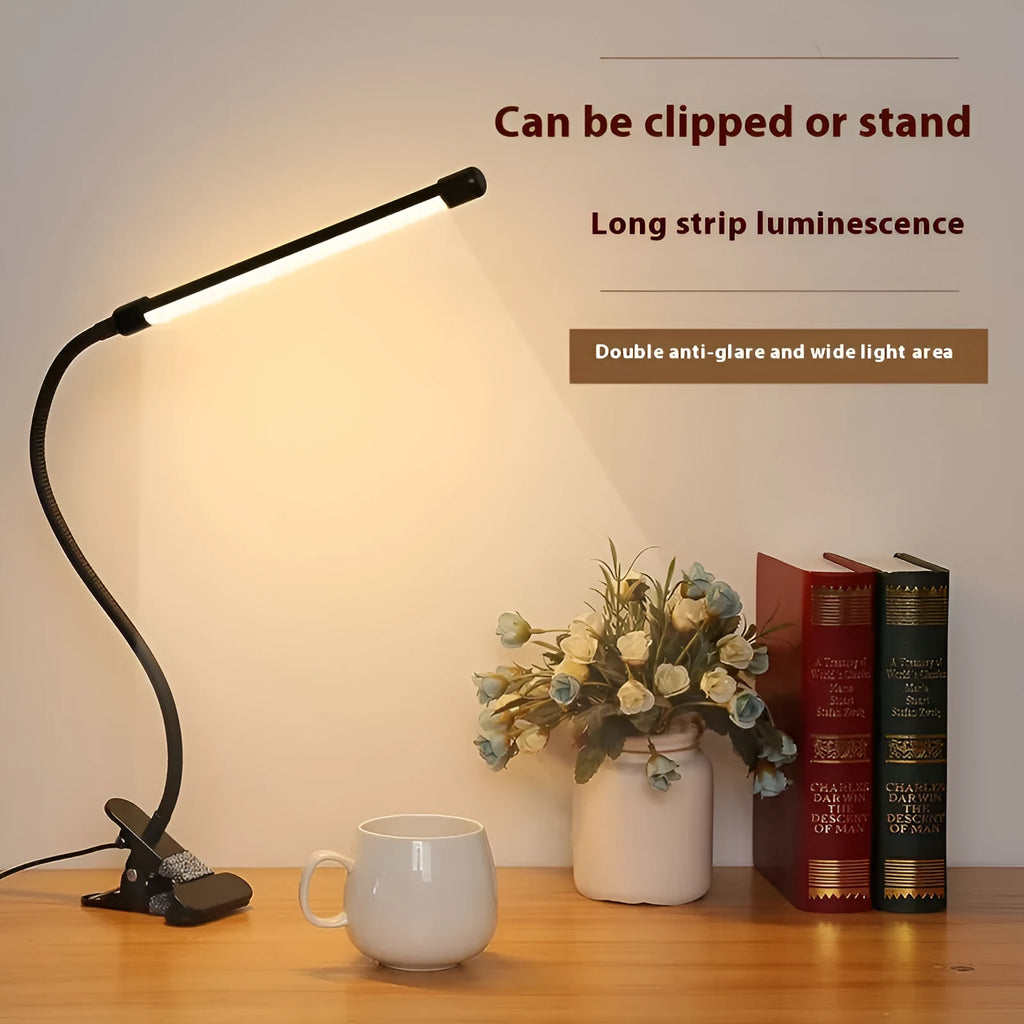 Black and white LED desk lamp with USB cable and 26cm long light bar on a desk.