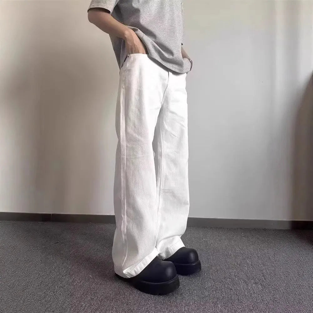 Men's straight leg white cotton denim jeans with wide leg opening and zipper fly