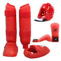Red karate taekwondo protective gear set with leg guard, helmet and boxing gloves on white background