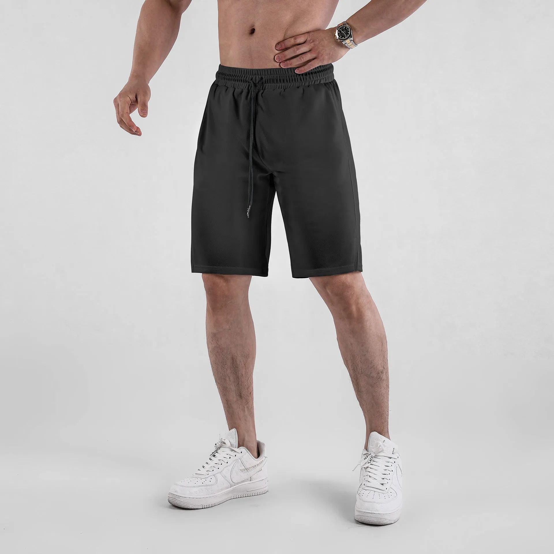 Men's black quick-drying mesh shorts with elastic waist and loose casual fit