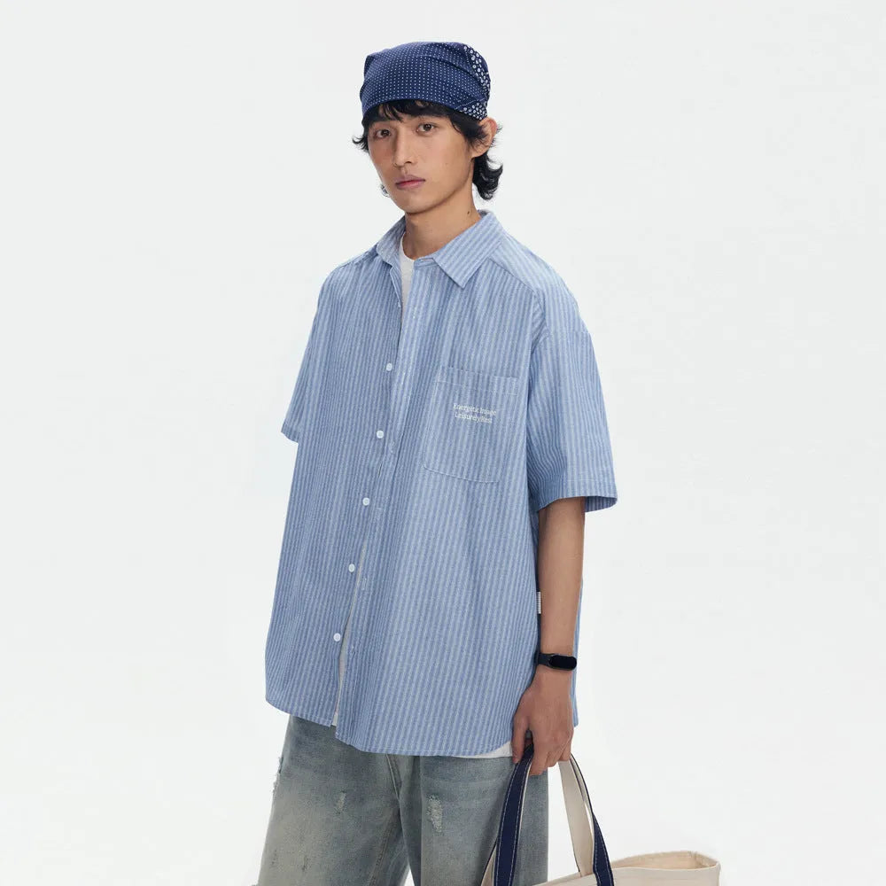 Blue striped short-sleeved overall shirt with cardigan style in cotton blend fabric