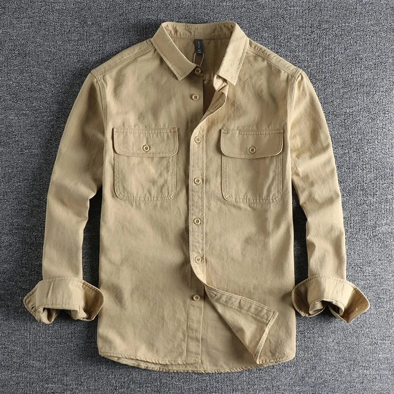 A man's loose-fitting long sleeve cardigan shirt in light grey, black, khaki, or green.