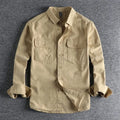 A man's loose-fitting long sleeve cardigan shirt in light grey, black, khaki, or green.