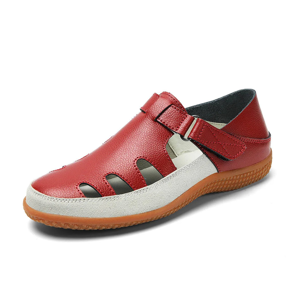 Women's plus size flat sandals with hollow out toe cap in blue, red, or white on thick rubber sole.