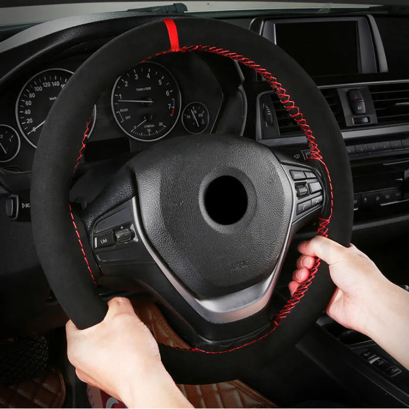 Black microfiber steering wheel cover with contrasting red stitch on 38cm diameter wheel