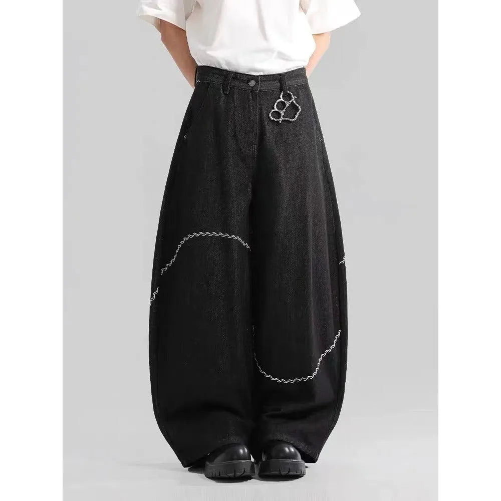 Black straight-leg denim trousers with micro-elastic fabric and mid-waist zip fly
