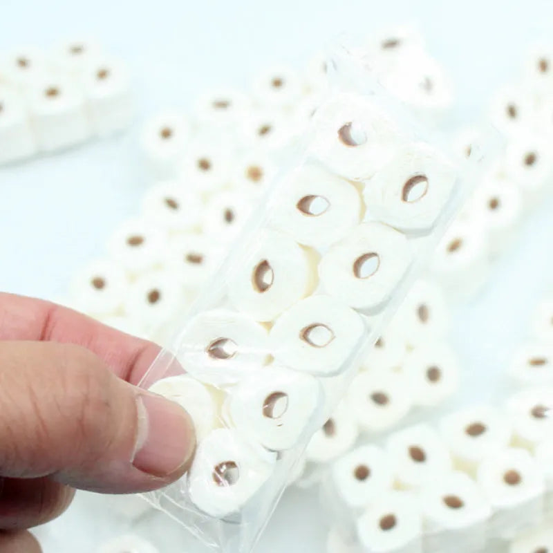 Miniature paper simulated tissue roll model for dollhouse play, measuring 30mm by 15mm by 80mm.