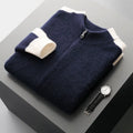 Man wearing a dark blue zip-up cardigan with a half turtleneck collar and thick wool fabric.