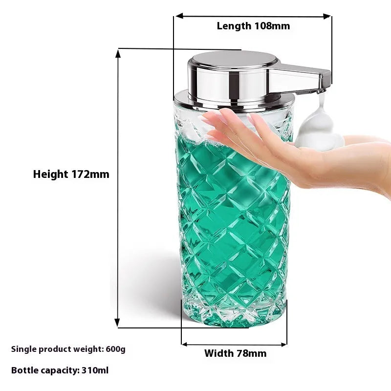 Silver automatic sensor soap dispenser with USB-C charging port on a bathroom countertop.