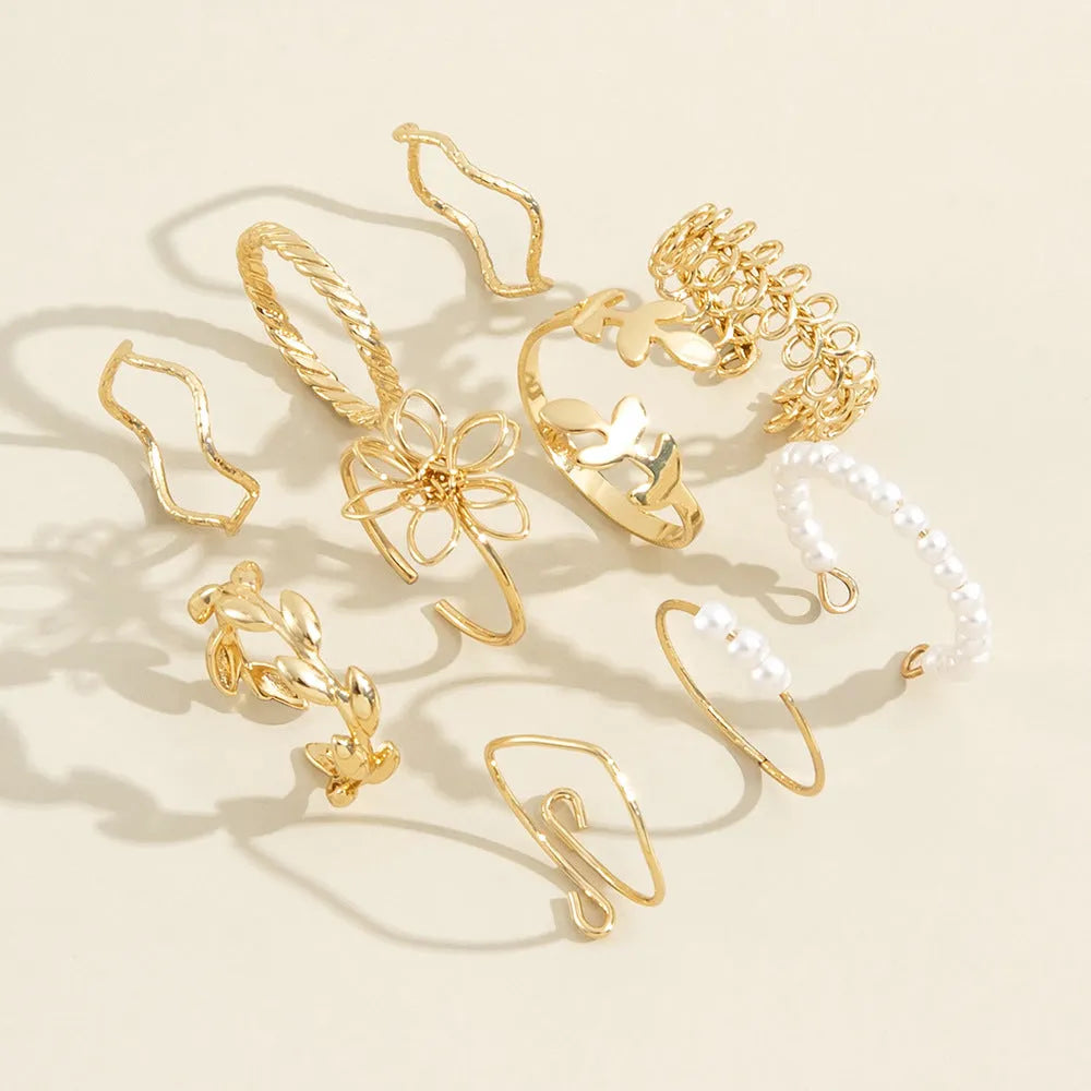 Openwork flower ring set with glossy gold finish and detailed floral pattern