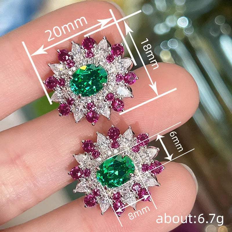 White gold stud earrings with oval zircon stone and geometric floral design on copper base
