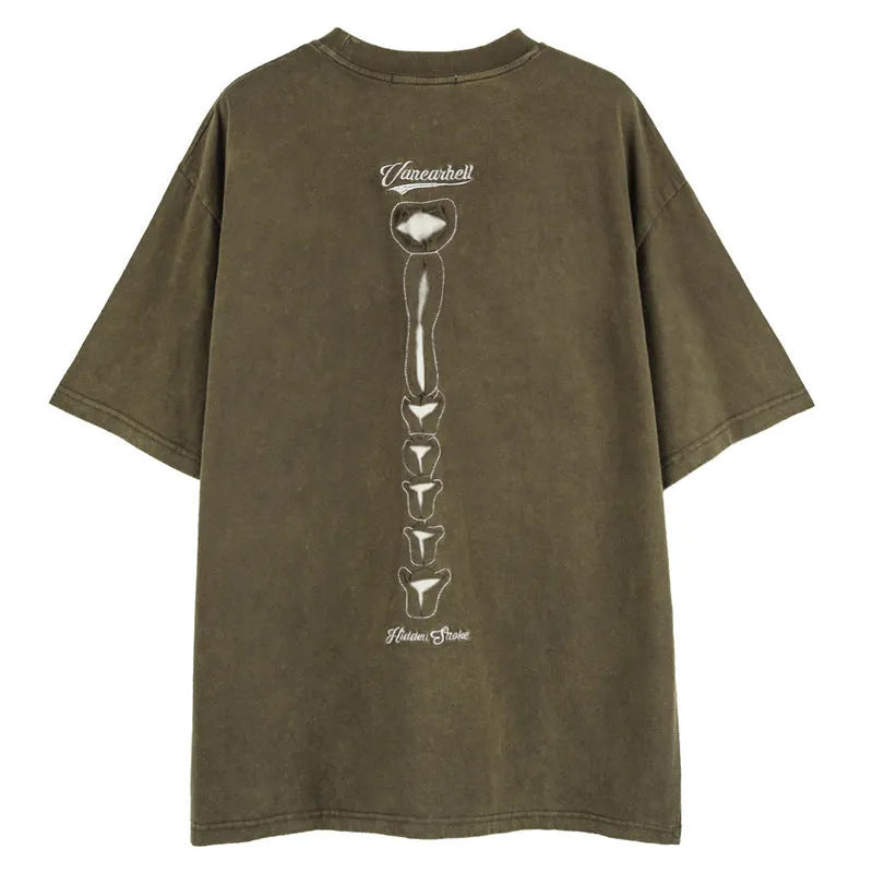 Dark high street style brown t-shirt with large skull graphic print and loose drop-shoulder sleeves.