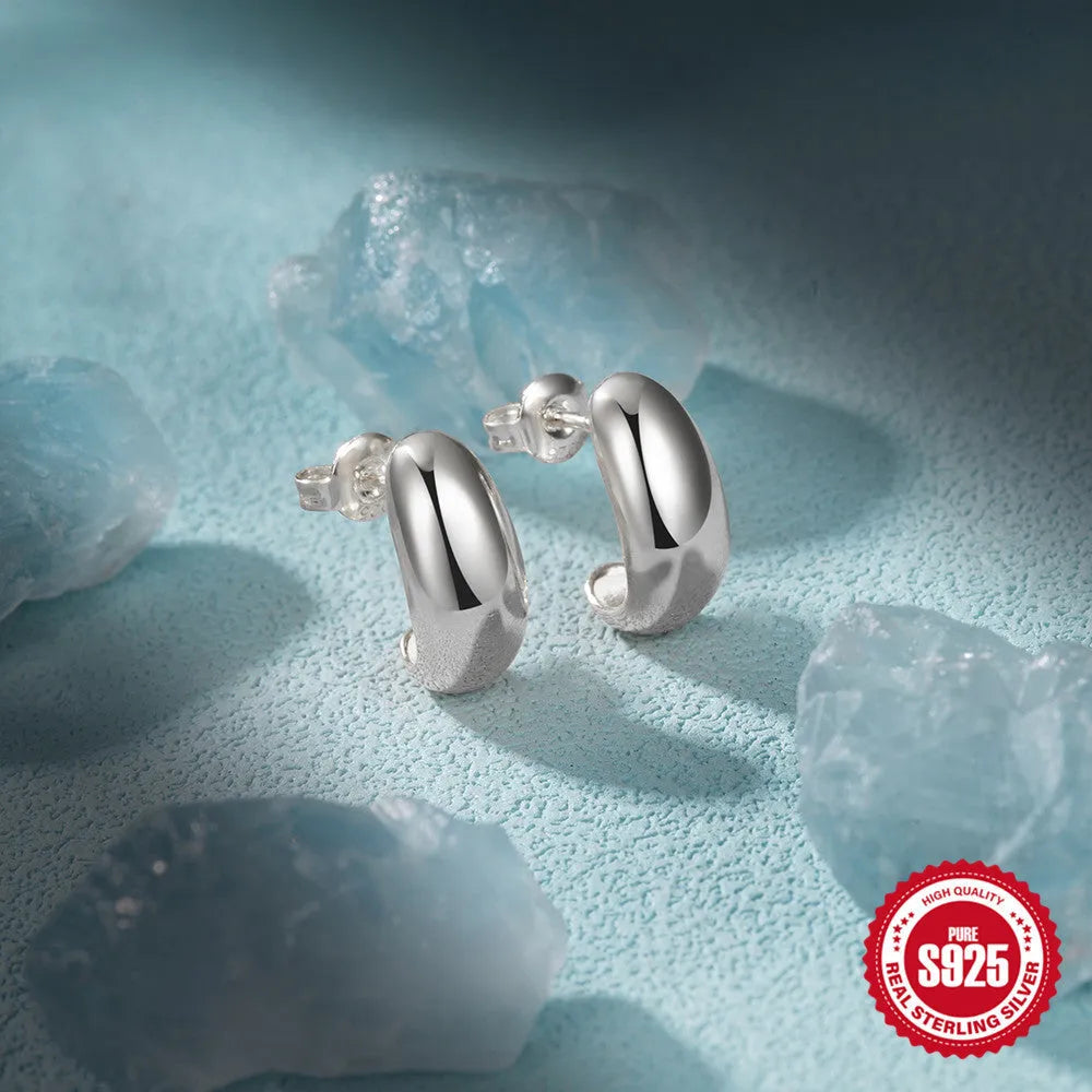 Sterling silver C-shaped stud earring with glossy electroplated finish in geometric design