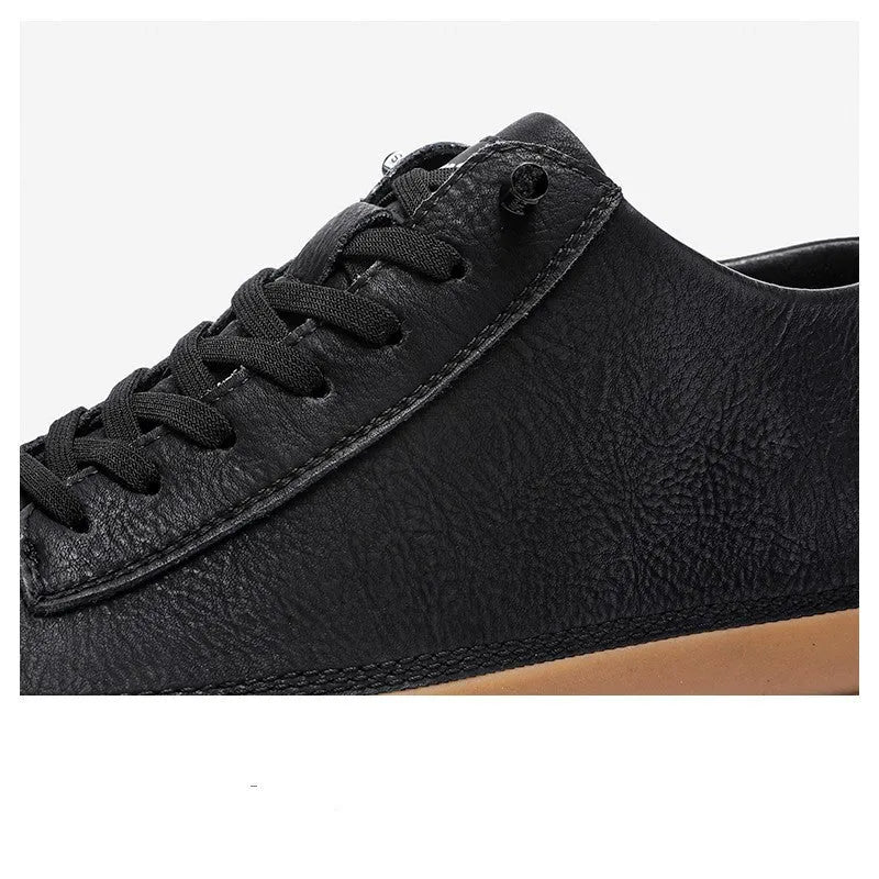 Men's black casual leather shoes with round toe and lace-up closure on white background
