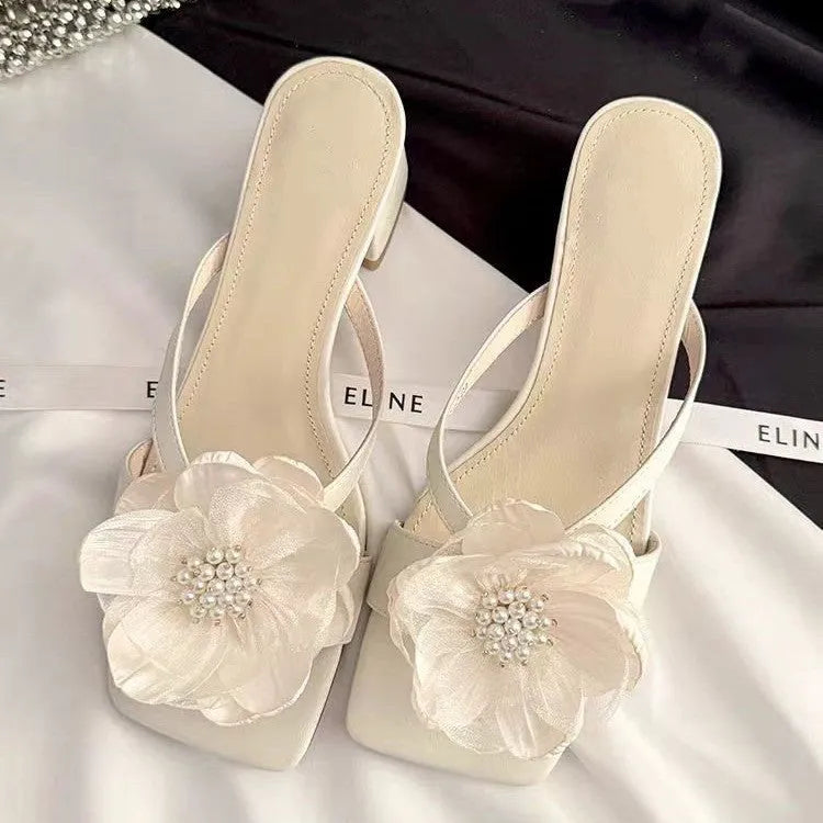 Women's cream satin sandals with a chunky block heel, square toe, and single cross-strap.