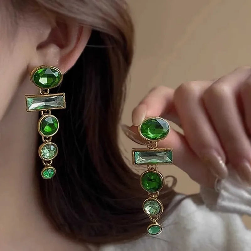 A pair of green gradient geometric alloy earrings with a tassel and inlaid zircon stones in a Chinese retro style.