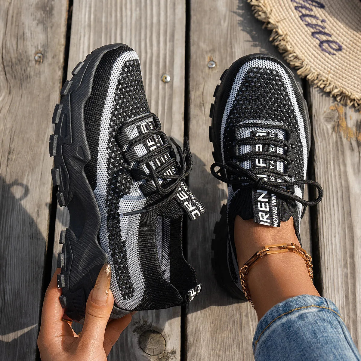 Women's Flyknit mesh lace-up sneakers in a multi-tone colourway with a low rubber sole.