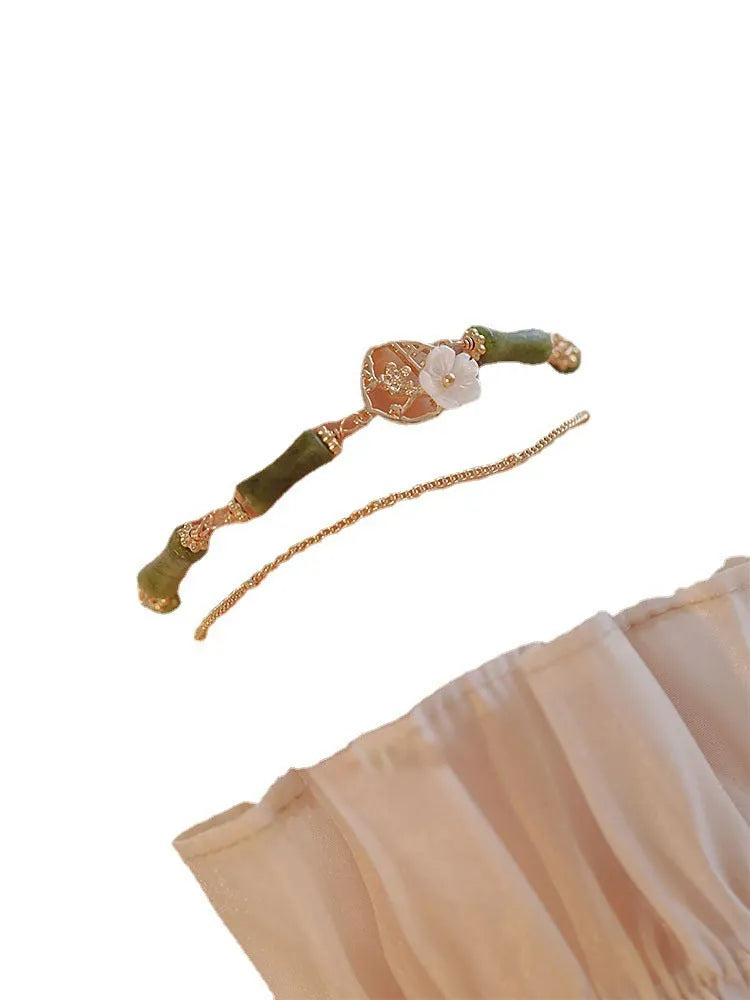 Natural green olivine bracelet with double layer design featuring olive branches and bells of Ireland motifs